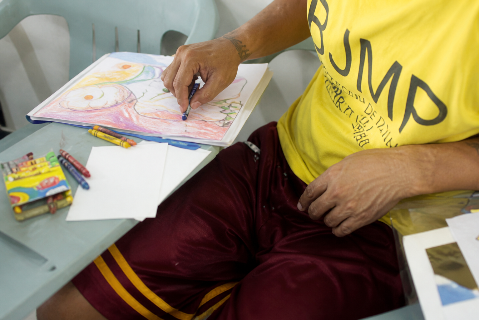 Participant taking part in a hands-on drawing class