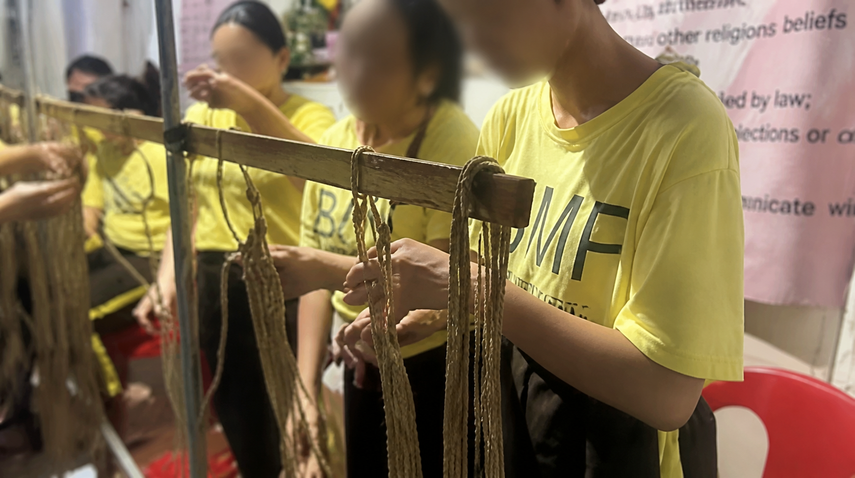 Participants making macrame and fiber crafts