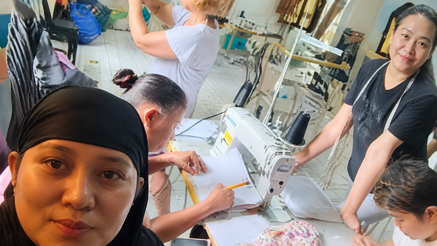 Participants learning sewing and pattern making